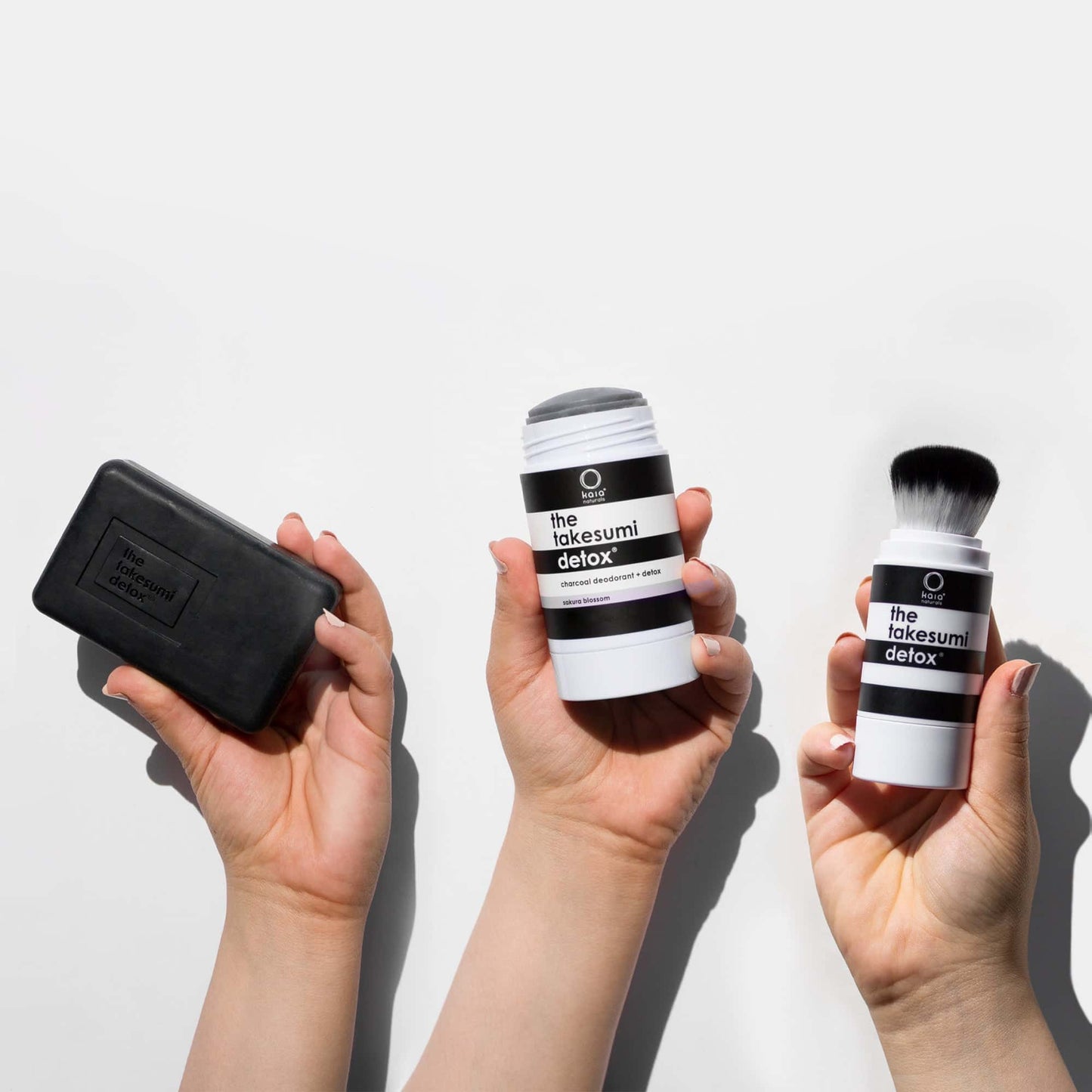 "3-STEP SYSTEM FOR EXCESS ODOR AND SWEAT" by Kaia Naturals, featuring a charcoal deodorant stick, a deodorant brush, and a detox bar.